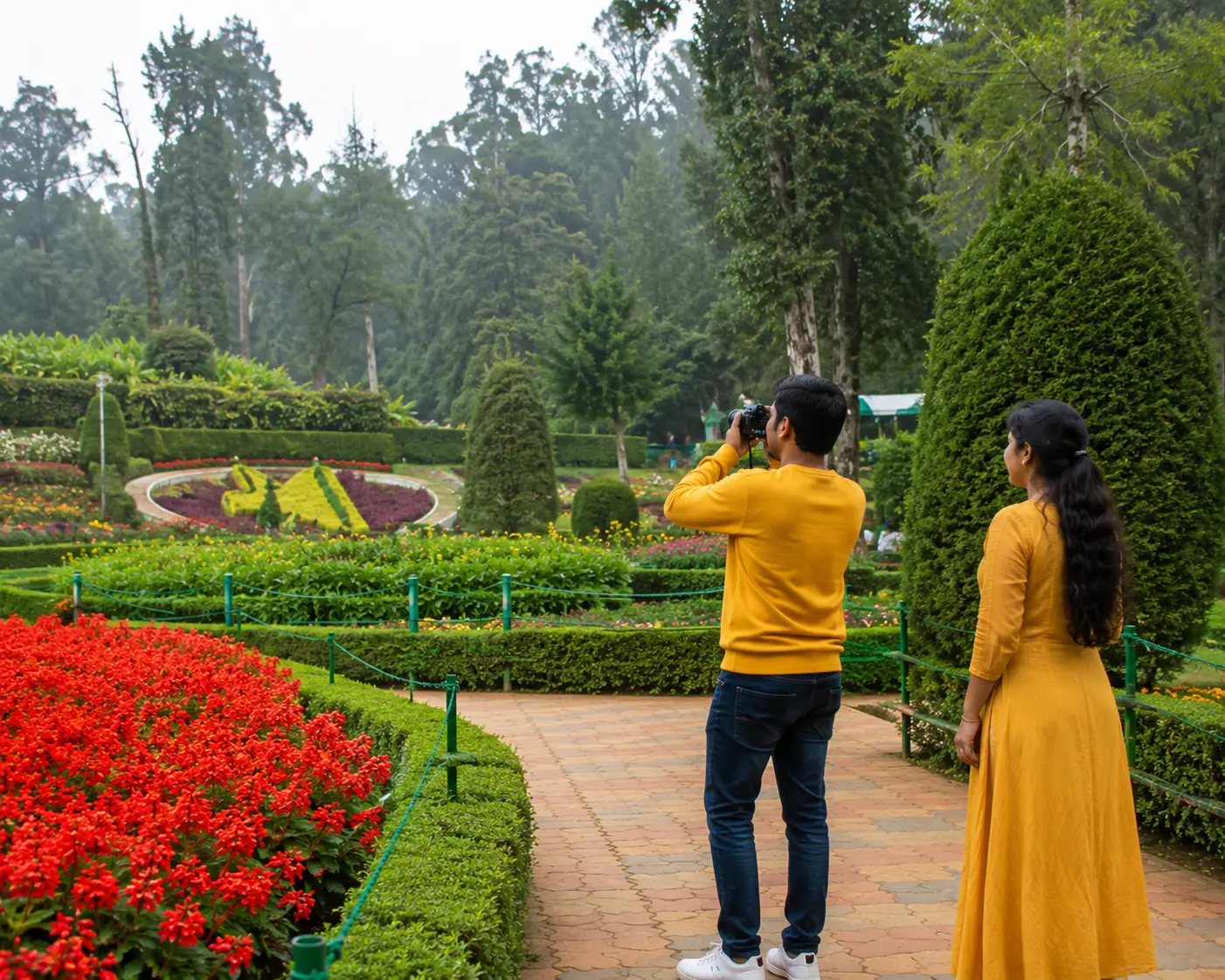Couple taking photographs during an Ooty Botanical Garden visit