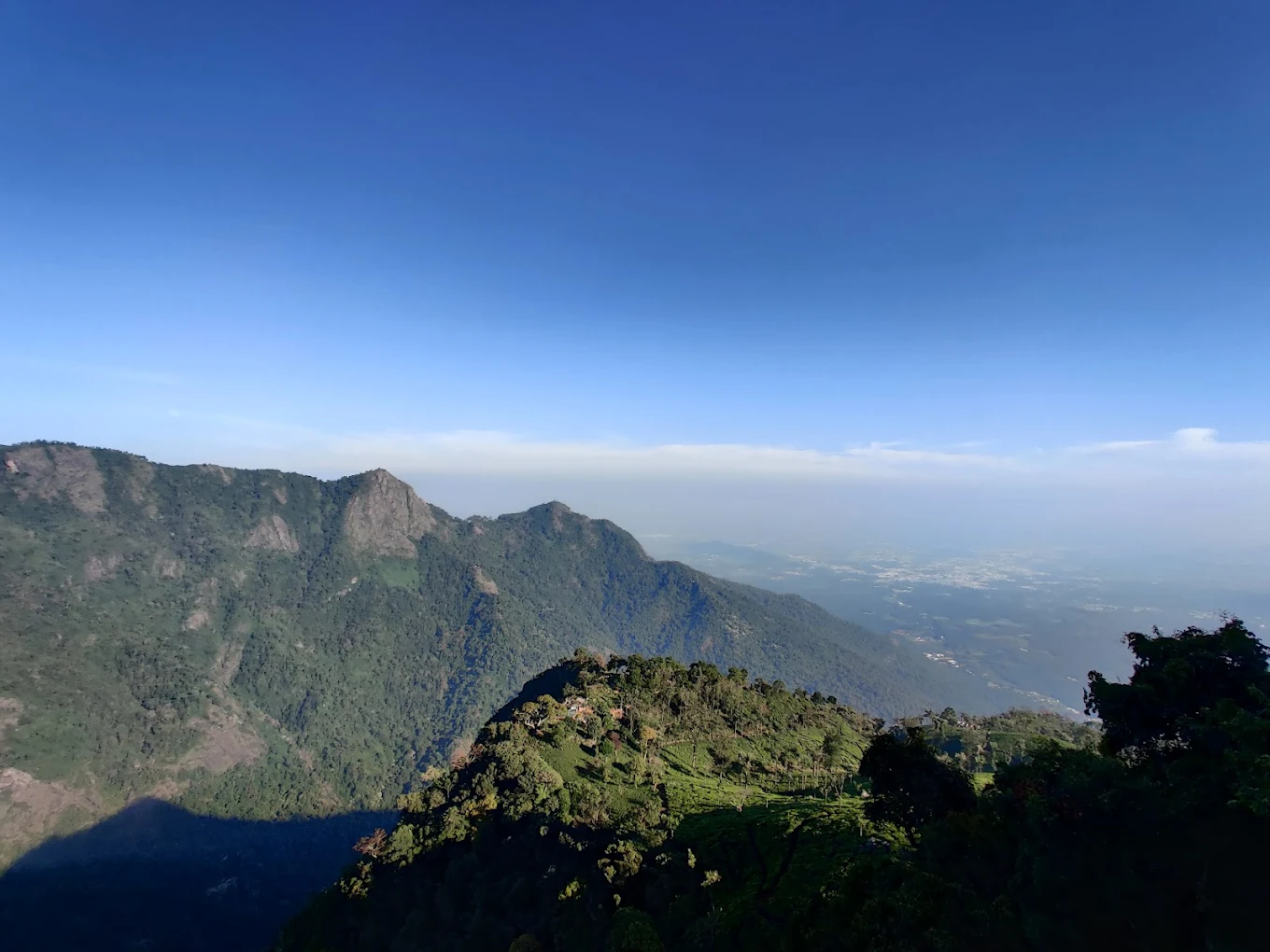 Dolphin's Nose viewpoint near Coonoor with deep canyon and distant Catherine Falls