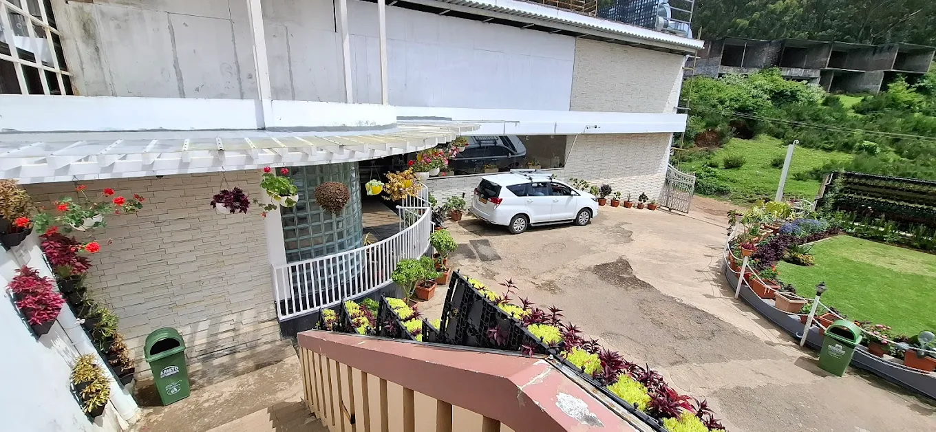 Vehicle parking space at Delightz Inn Ooty