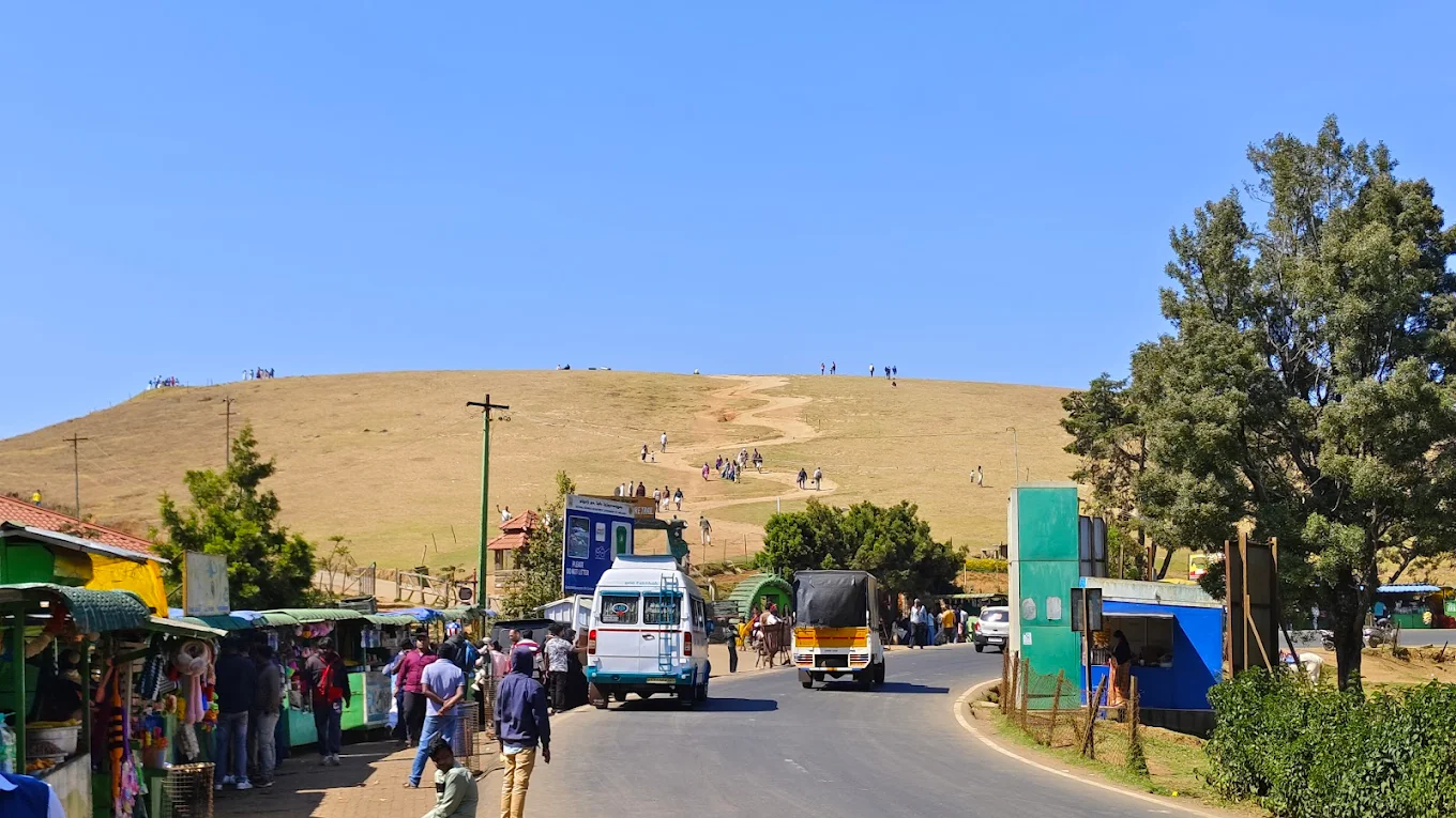 Wenlock Downs (9th Mile) near Ooty with rolling grasslands and distant hills